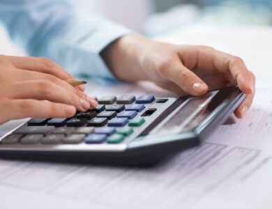 small business tax accountant professional calculating tax deductions before year-end