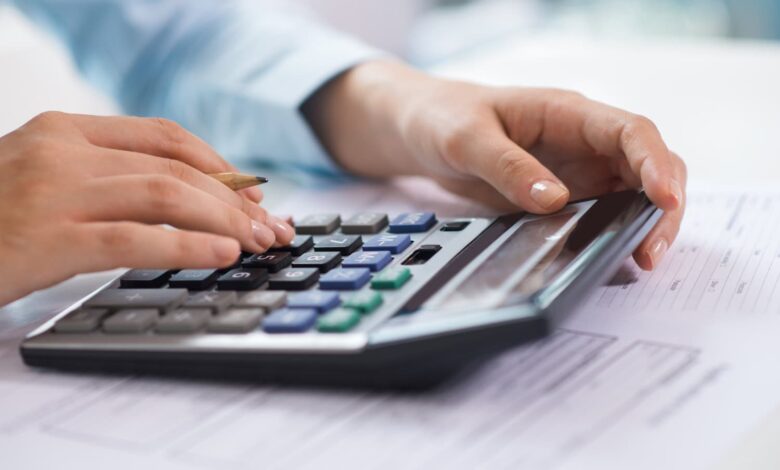 small business tax accountant professional calculating tax deductions before year-end